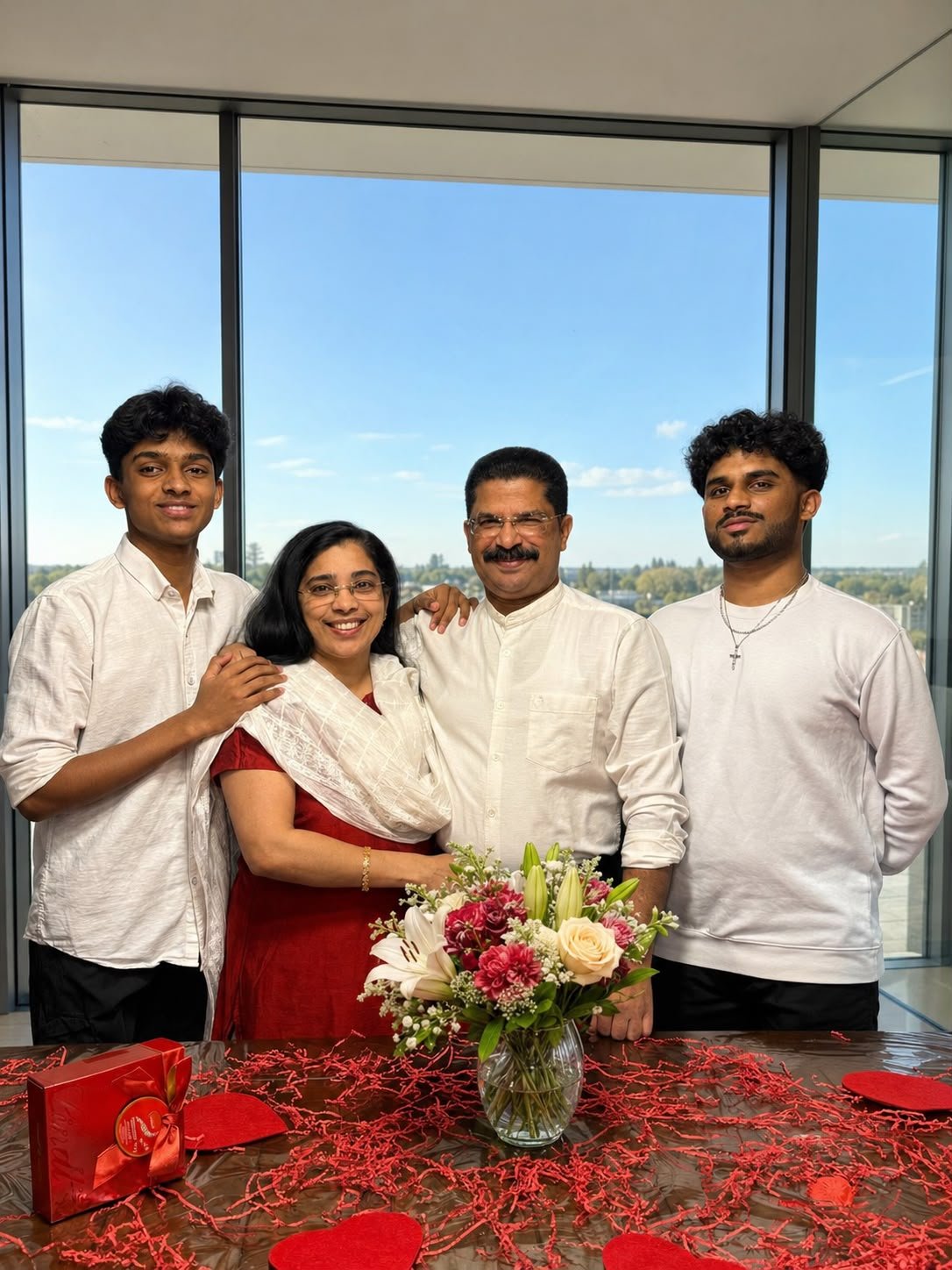 Bensy Mathew with his wife and two sons